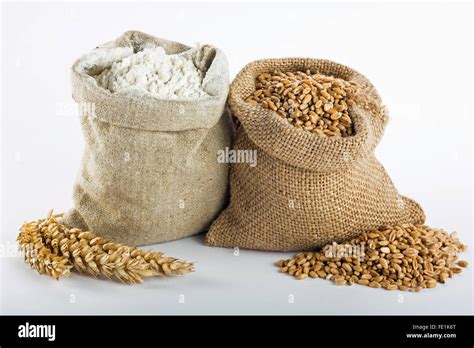 Flour and wheat grain in small burlap sacks Stock Photo - Alamy