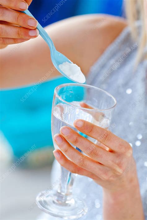 Woman Using Baking Soda Stock Image C Science Photo Library