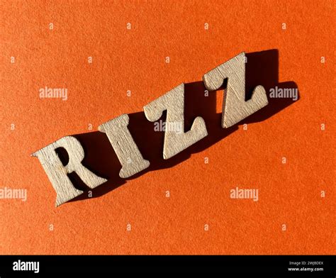 Rizz, slang word for charisma used by Gen Z, in wooded alphabet letters ...