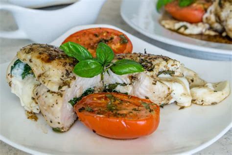 Spinach Mozzarella Stuffed Chicken With Roasted Tomatoes Babaganosh