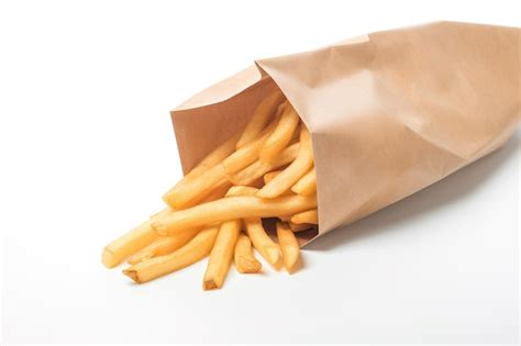 Premium Ai Image French Fries In A Paper Bag Isolated On White Background