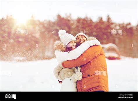 happy couple hugging and laughing in winter Stock Photo - Alamy