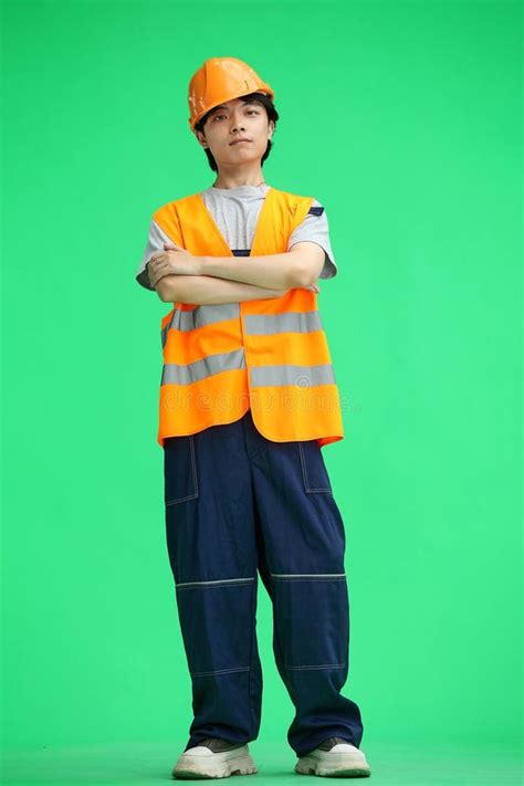 construction guy   green background  full height crossed