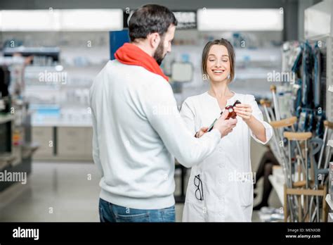 Pharmacist With Client In The Pharmacy Store Stock Photo Alamy