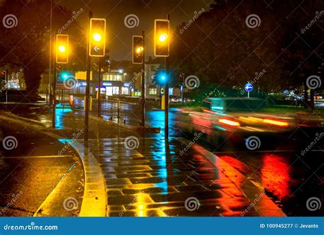 Night Rain View Yellow Traffic Lights at UK Roundabout Editorial ...