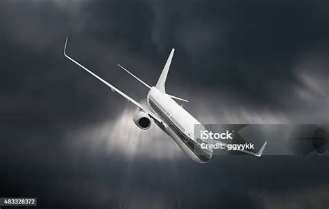 Passenger Airplane Falling From Sky Against Stormy Cloudscape Stock