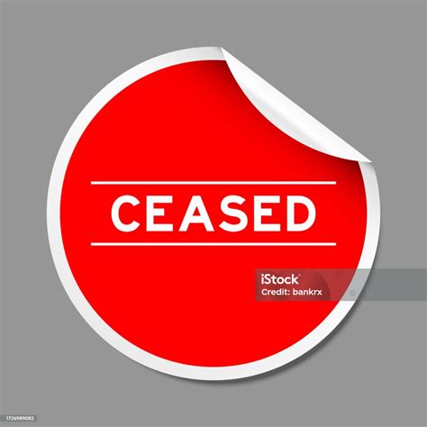 red color peel sticker label  word ceased  gray background stock
