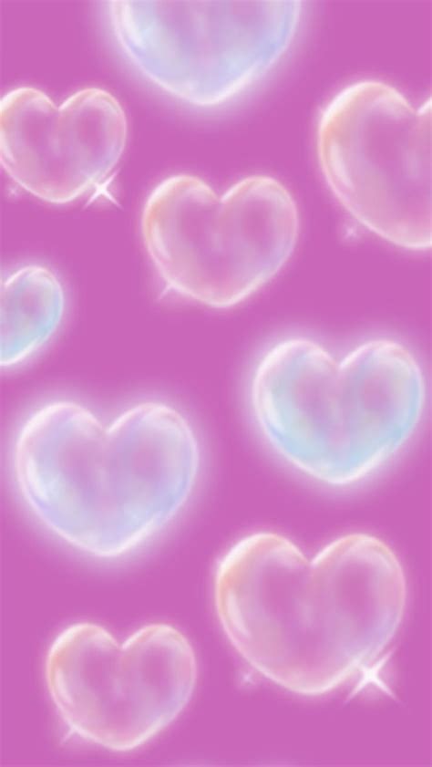 Soap Bubbles In The Shape Of Hearts On A Pink Background