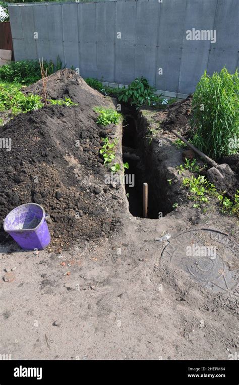 Digging Trench For Sewer Pipes During House Construction Trench For Sanitary Sewer Pipe In The