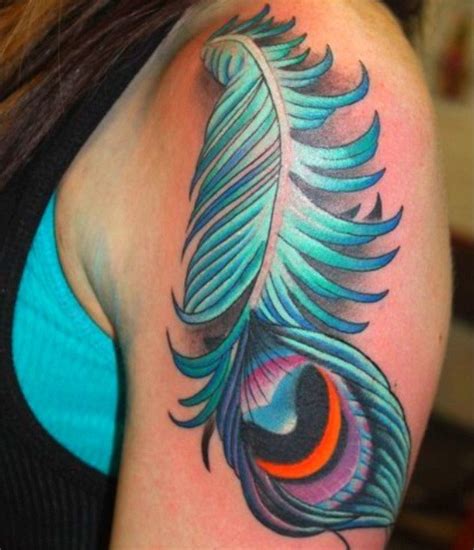 Great Blue Colored Peacock Feather Tattoo For Women On Upper Arm