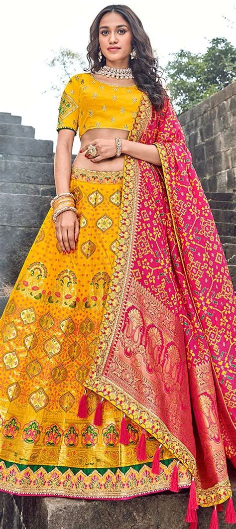 Festive Reception Yellow Color Banarasi Silk Fabric Lehenga 1629677