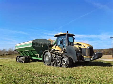 AGCO Challenger MT765D Tractor Pulling A Killbros 1820 Grain Cart In