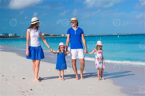 Family of four on beach vacation 17704194 Stock Photo at Vecteezy