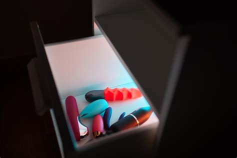 Premium Photo Different Sex Toys In Open Chest Of Drawers