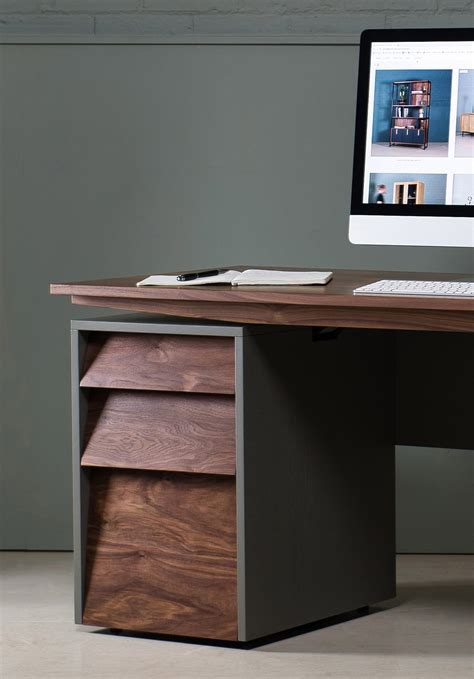 This sit-stand desk perfectly fuses the good looks of traditional