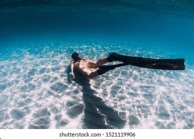 Naked Woman Freediver Glides Over Sandy Stock Photo