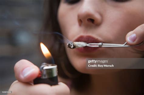 Woman Smoking Joint High Res Stock Photo Getty Images