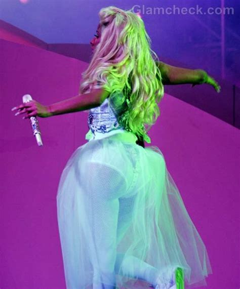 Nicki Minaj Sports All-white Ensemble in Concert