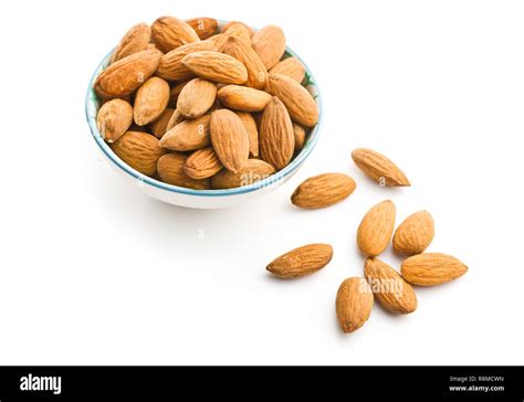 Dried Almond Nuts In Bowl Isolated On White Background Stock Photo Alamy