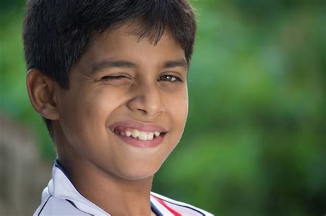 Premium Photo A Handsome Smart Happy Indian Kid Looking At A Distance