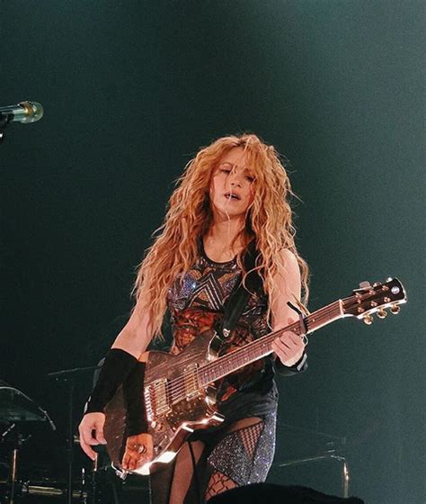 Shakira Playing Guitar