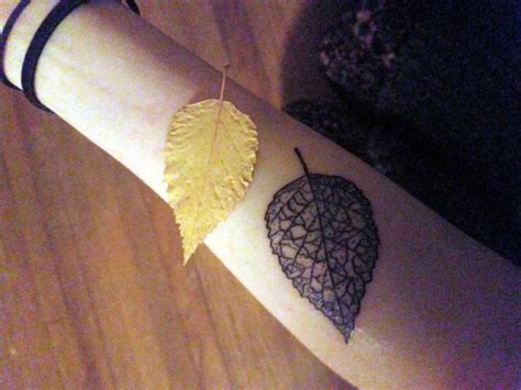 Skeleton of a paper birch leaf tattoo.