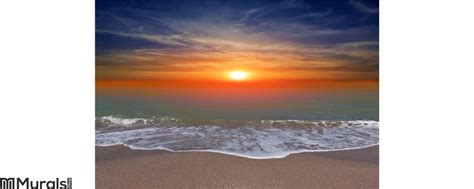 Sunset over ocean beach Wall Mural