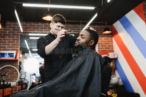 Visiting Barbershop. African American Man in a Stylish Barber Shop ...