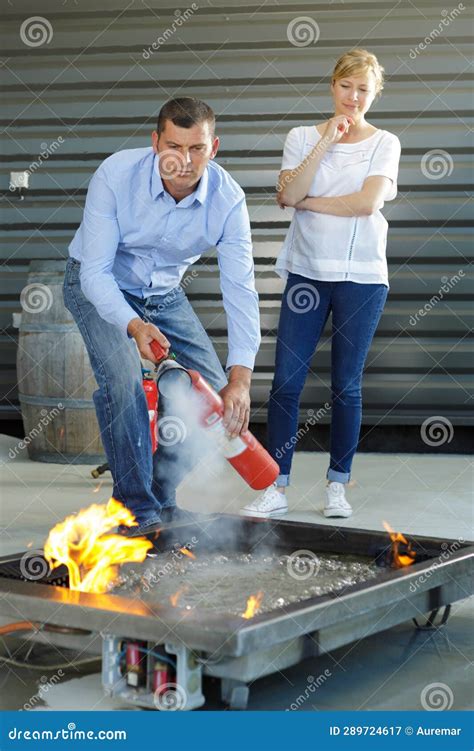 Man Extinguishing Controlled Fire For Training Purposes Stock Image Image Of Burn Exercise