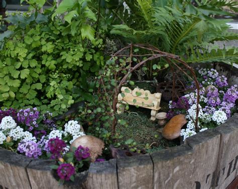 Fairy Garden In A Whiskey Barrel Fairy Garden Accessories Fairy