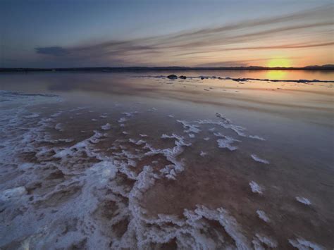 Sunset On The Pink Lagoon Of The Salt Flats Of Torrevieja Spain