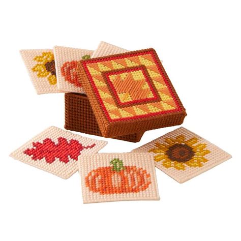 cross stitch coasters with autumn designs on the front and back, set of ...