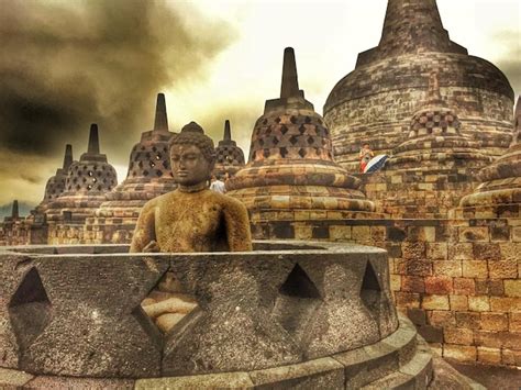 Premium Photo | Buddha sculpture and stupas at borobudur sky