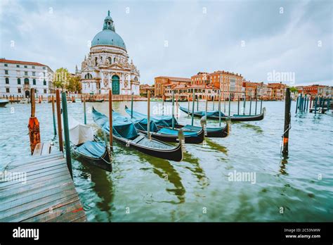 Gondola On Canal Grande With Basilica Di Santa Maria Della Salute In