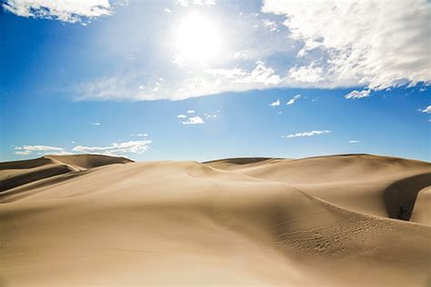 Sandboarding and Sand Sledding at Great Sand Dunes National Park in Colorado | Wander The Map