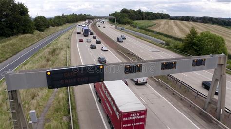 K Aerial Footage Of Traffic Jam On Managed Motorway With Caution Sign