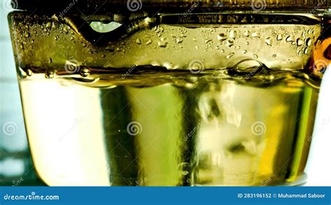 Captivating Heat Close Up Of Boiling Water In A Glass Pen Unveiling