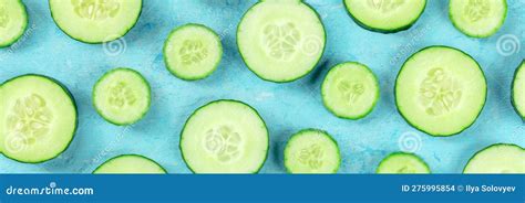 Fresh Cucumber Slices On A Blue Background Panorama Overhead Flat Lay