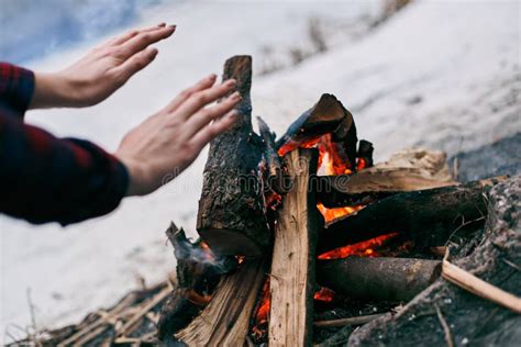 Man Warms His Hands Over Forever Burning Fire Of Mount Chimaera In