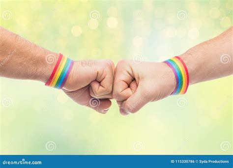 Hands With Gay Pride Wristbands Make Fist Bump Stock Photo Image Of