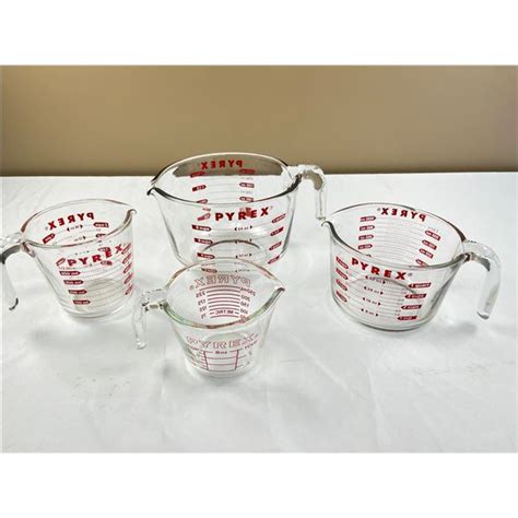 4 Pyrex Measuring Cups - Sunrise Estate Services Ltd