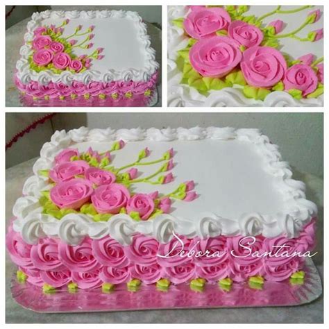 The Cake Is Decorated With Pink Roses And Green Leaves