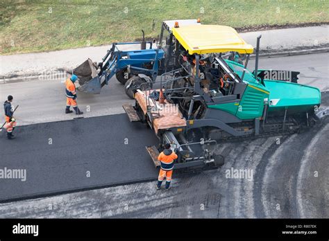 Asphalt Paver Machine Tractor On The Road Repair Site Road Renewal