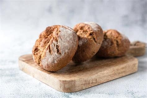 Premium Photo Round Fresh Buns Made From Whole Grain Or Rye Flour Lie