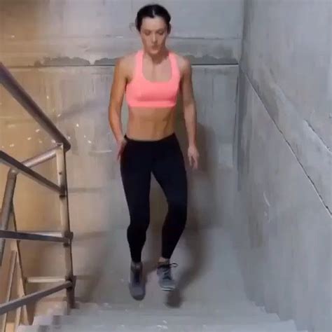 A Woman Is Walking Up Some Stairs