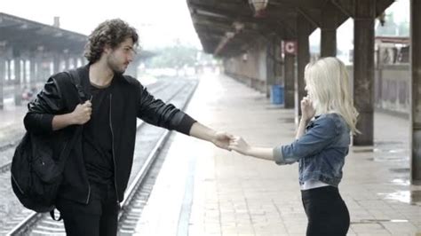 young loving couple  kissing  talking  public   street