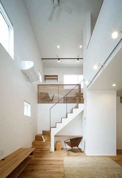 The Stairs In This Modern House Are Made Of Wood And Have Been Designed