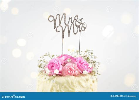 Wedding Or Birthday 2 Tiered Cake With Bokeh Party Lights Stock Photo