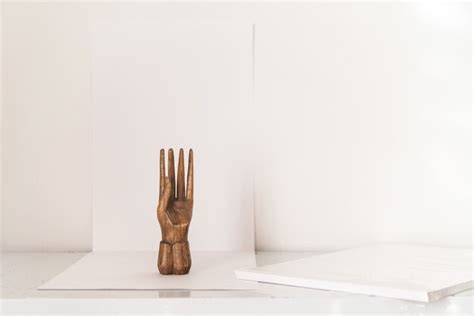 Premium Photo | Wooden hand sculpture on photo studio