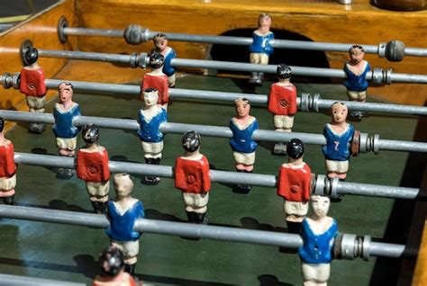 Premium Photo | Vintage foosball table with hand painted figures